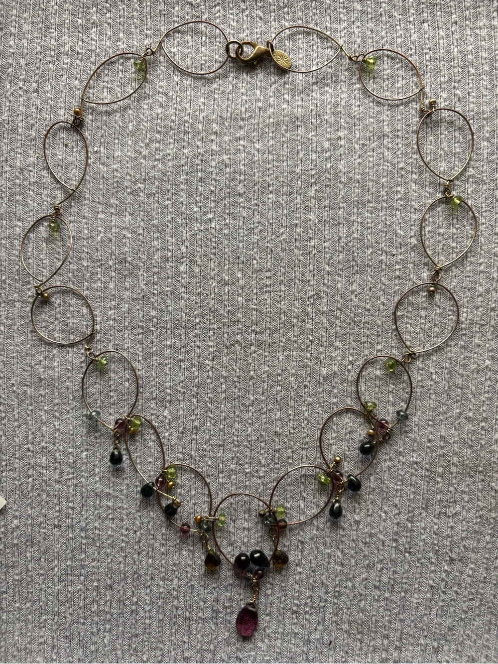 Vintage gold tone Lydell NYC intertwined hoops necklace w multicolor beads